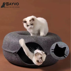 Two kittens playing in and on a dark grey round felt cat tunnel bed, with an inset showing the cat-shaped opening.