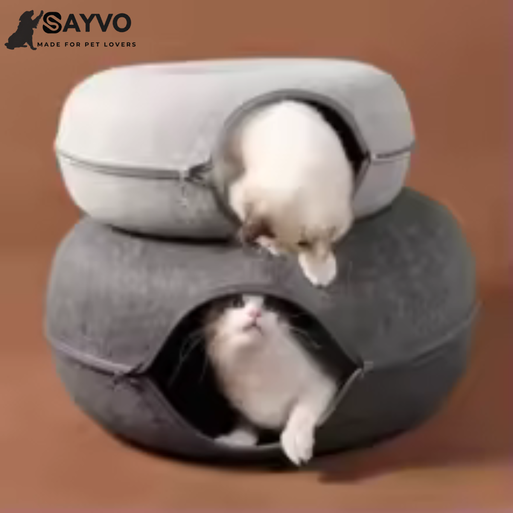 Two cats peeking through the openings of light and dark grey round felt cat tunnel beds shown stacked together.