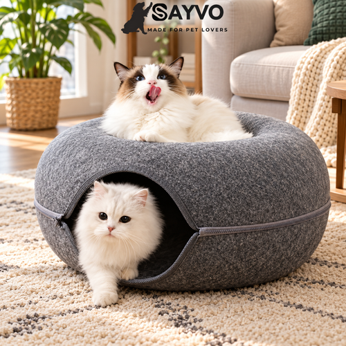 Two cats resting in a round felt cat tunnel bed with a cosy central nest, cat-shaped entrance and zippered detachable sides.