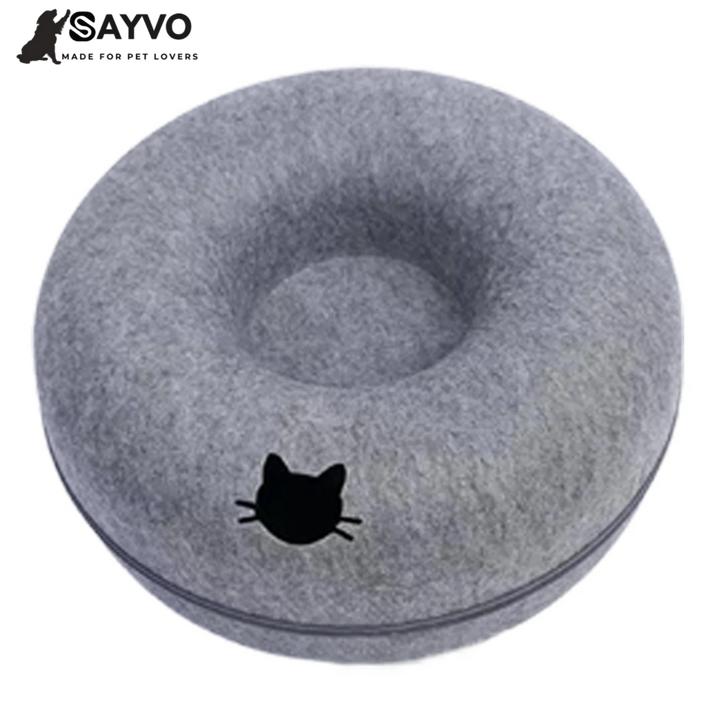 Round grey felt cat tunnel bed with a cat-shaped opening and central sleeping nest; graphic advertises 50% off and free delivery.