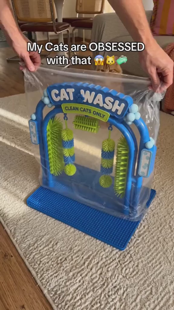 Video showing cats walking through the blue SAYVO grooming arch and rubbing their cheeks and bodies against the green side brushes.